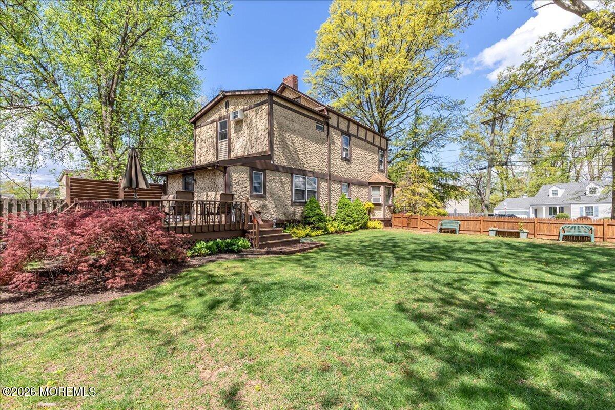 225 Freeman Street Woodbridge, NJ 07095 - Photo 35 of 39 a front view of a house with garden