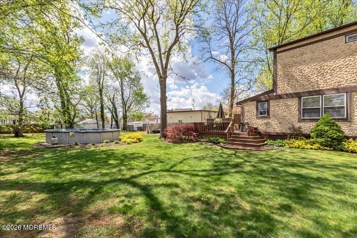 225 Freeman Street Woodbridge, NJ 07095 - Photo 36 of 39 a view of backyard with swimming pool