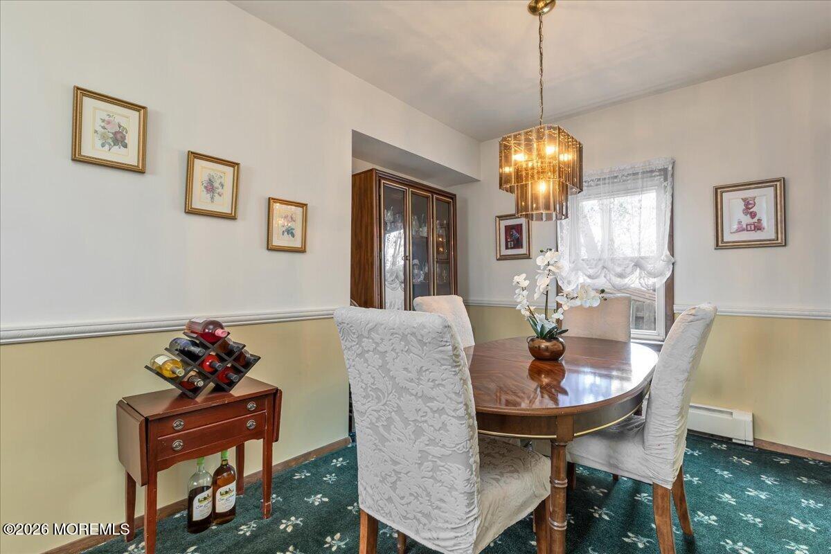 225 Freeman Street Woodbridge, NJ 07095 - Photo 7 of 39 a dining room with furniture and window