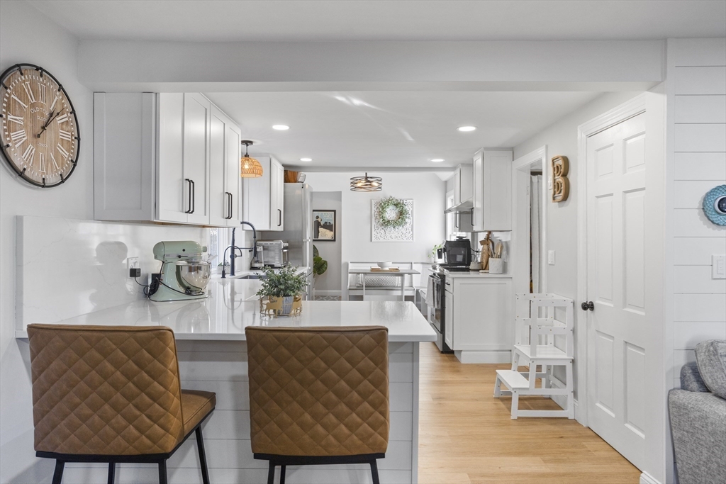 85 Red Acre Road Stow, MA 01775 - Photo 11 of 36 a living room with furniture a large window and stainless steel appliances