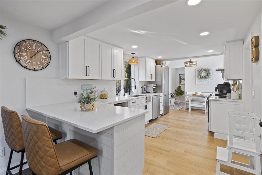 85 Red Acre Road Stow, MA 01775 - Photo 12 of 36 a view of kitchen with cabinets and wooden floor