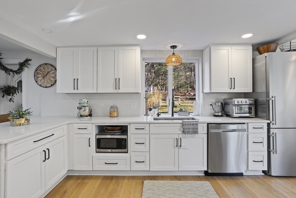 85 Red Acre Road Stow, MA 01775 - Photo 14 of 36 a kitchen with appliances cabinets and a window