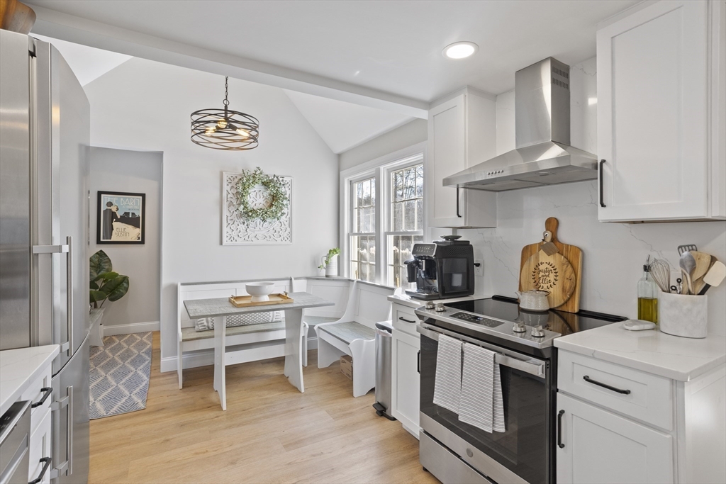 85 Red Acre Road Stow, MA 01775 - Photo 16 of 36 a kitchen with stainless steel appliances granite countertop a stove and a wooden floors