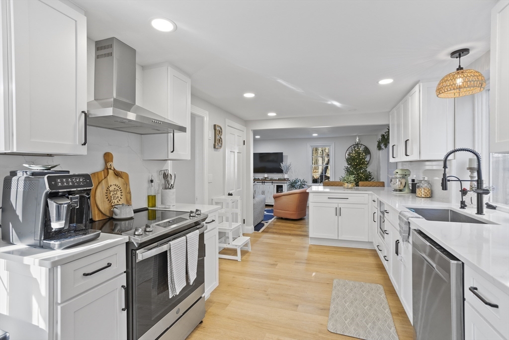 85 Red Acre Road Stow, MA 01775 - Photo 19 of 36 a kitchen with stainless steel appliances granite countertop a stove a sink and a refrigerator