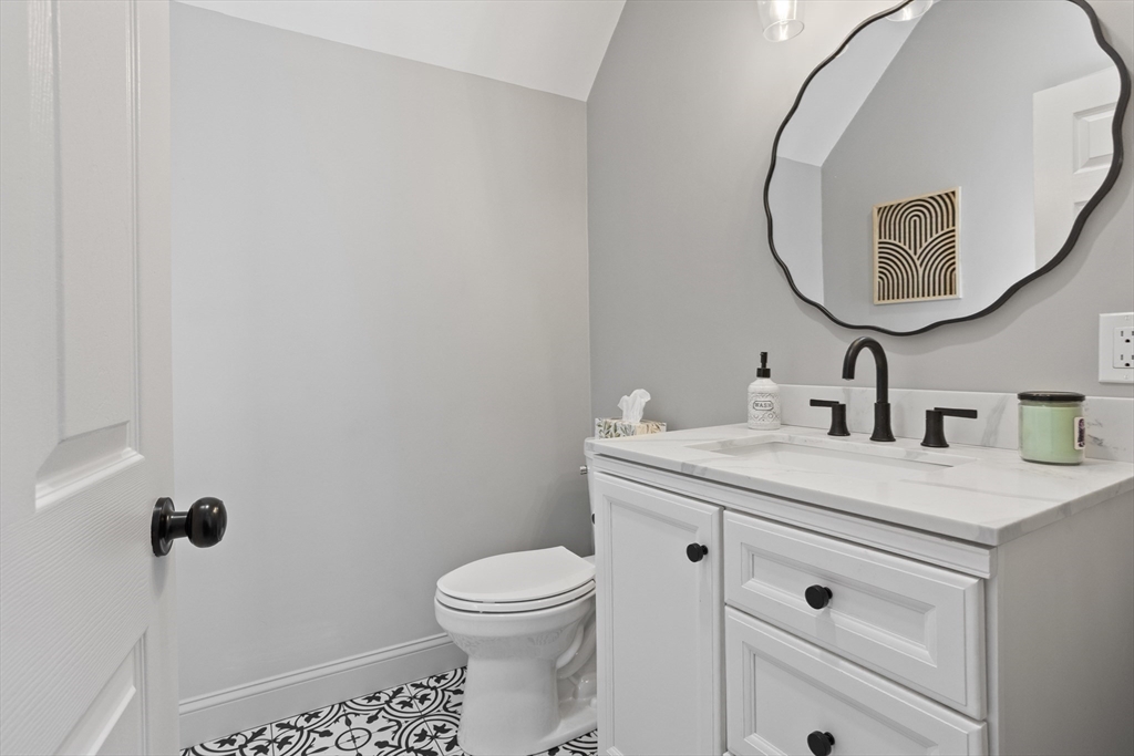 85 Red Acre Road Stow, MA 01775 - Photo 20 of 36 a bathroom with a sink a toilet and a mirror