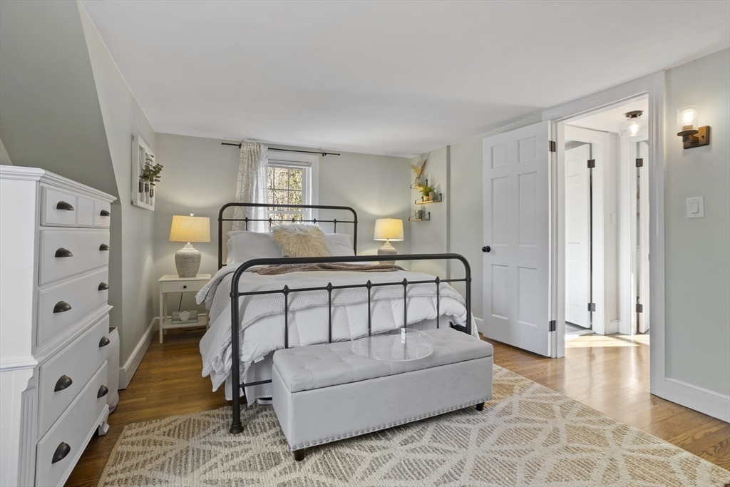 85 Red Acre Road Stow, MA 01775 - Photo 27 of 36 a bedroom with furniture and a window