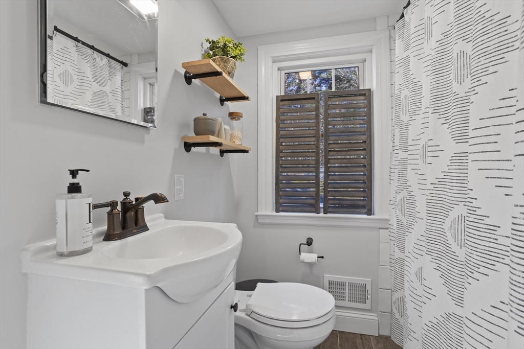 85 Red Acre Road Stow, MA 01775 - Photo 28 of 36 a bathroom with a toilet sink and mirror