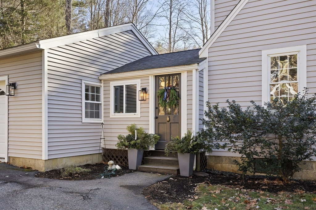 85 Red Acre Road Stow, MA 01775 - Photo 3 of 36 a view of a house with chairs and potted plants