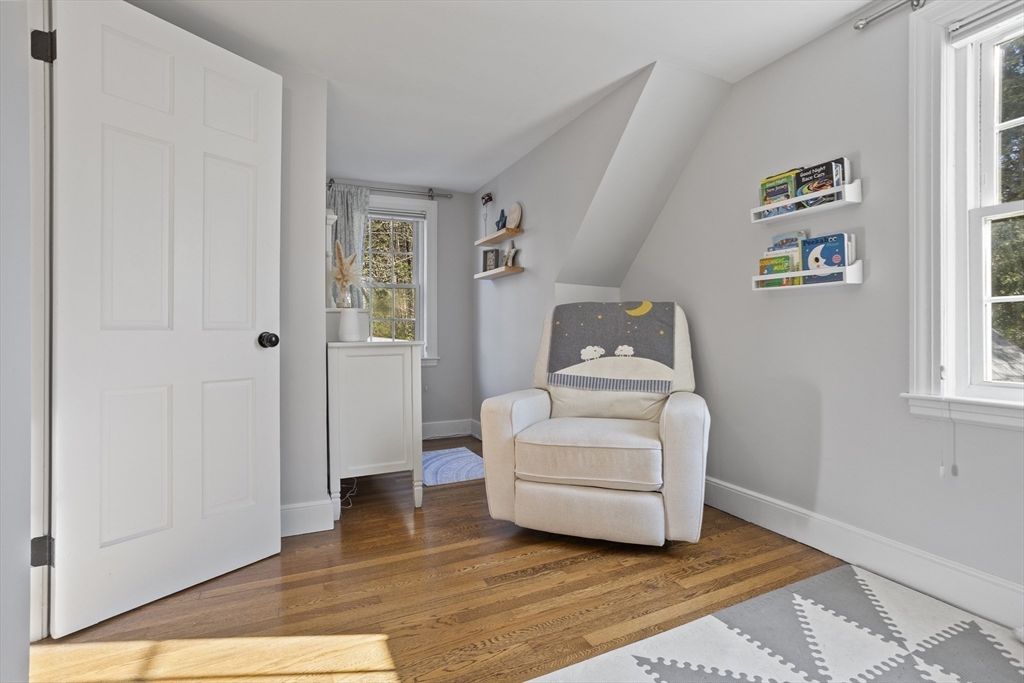 85 Red Acre Road Stow, MA 01775 - Photo 31 of 36 a room that has a couch and a wooden floor in it