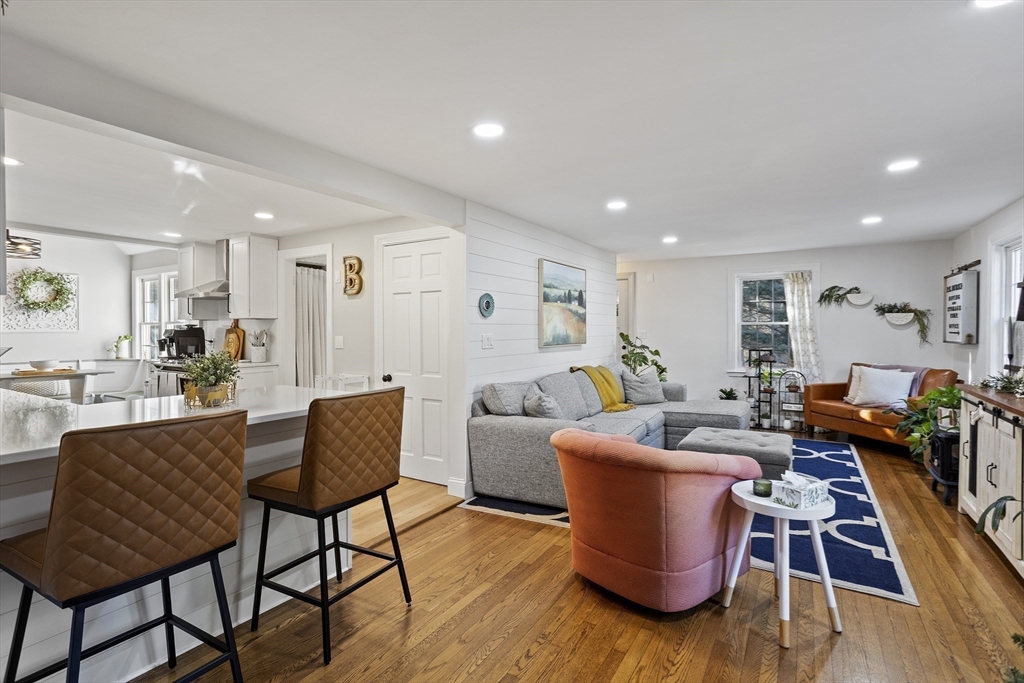 85 Red Acre Road Stow, MA 01775 - Photo 8 of 36 a living room with furniture a wooden floor and a dining table