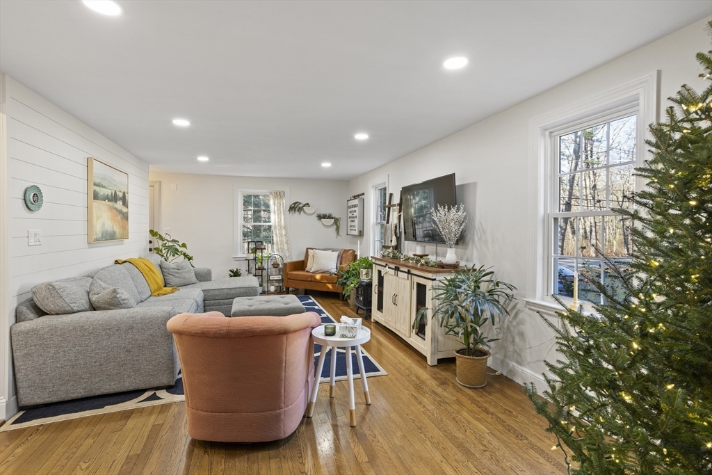 85 Red Acre Road Stow, MA 01775 - Photo 10 of 36 a living room with furniture and a flat screen tv