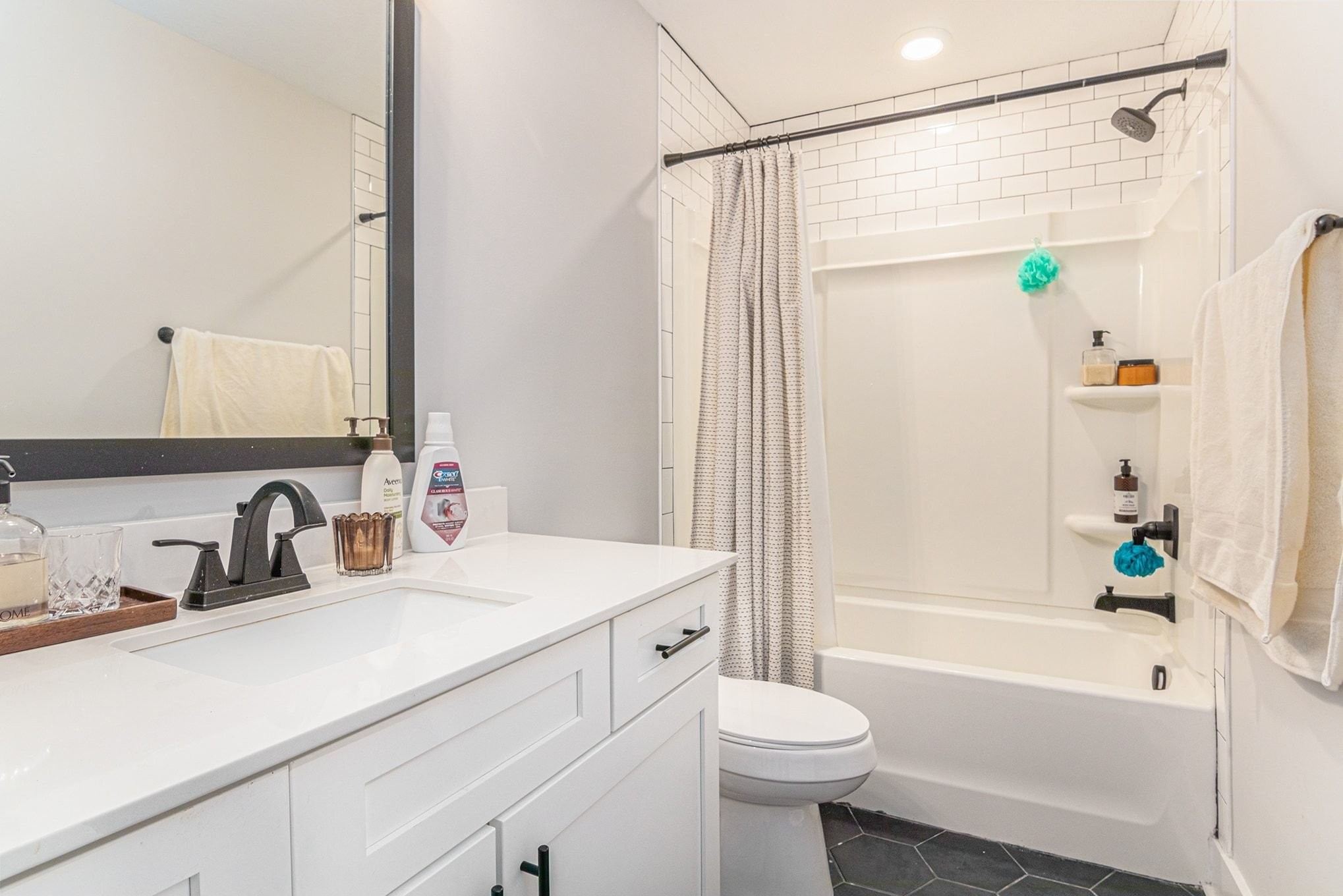 786 Limestone Way Clarksville, TN 37043 - Photo 21 of 29 a bathroom with a sink a toilet a mirror a bathtub and shower