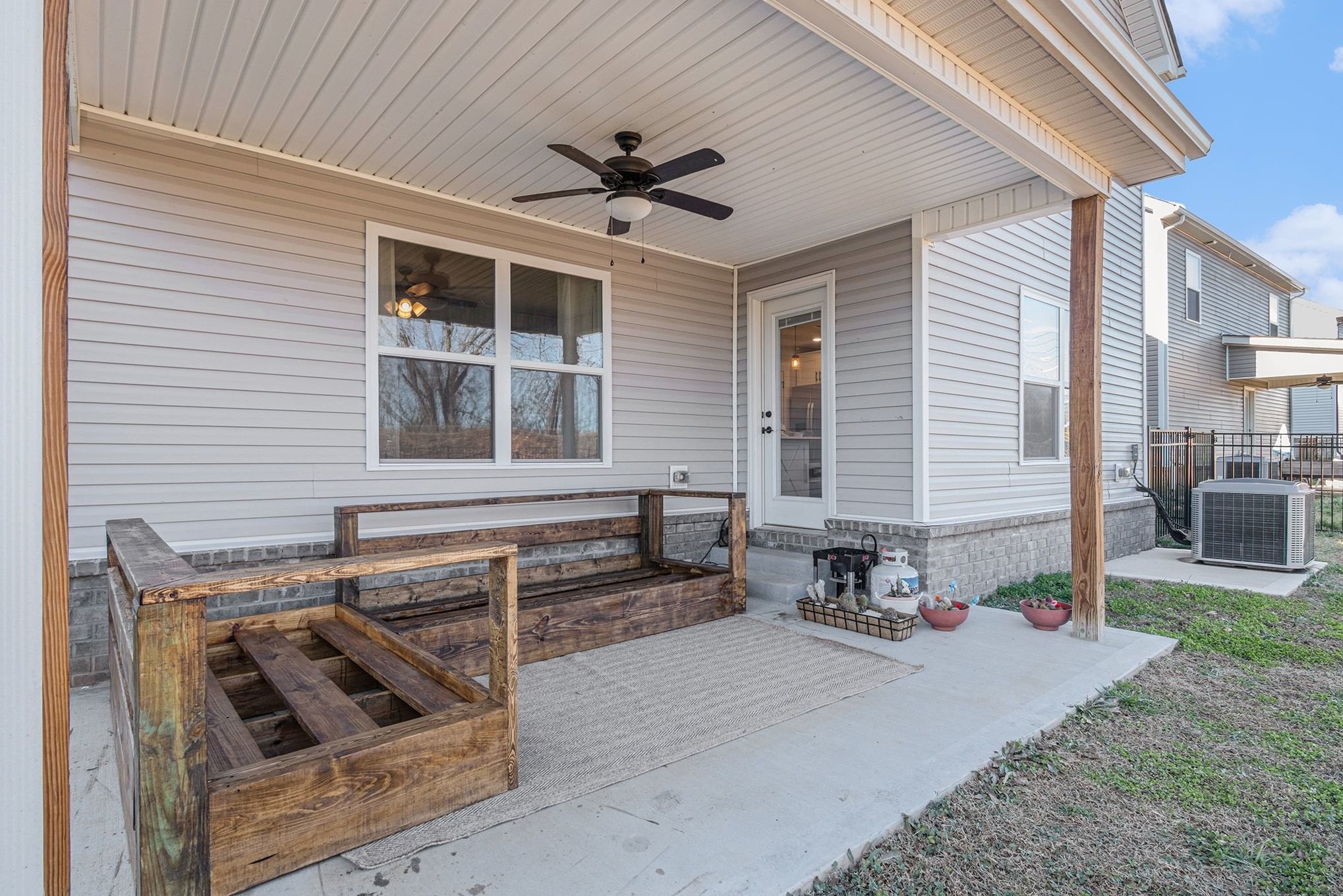 786 Limestone Way Clarksville, TN 37043 - Photo 25 of 29 a view of a patio with table and chairs with wooden floor and fence