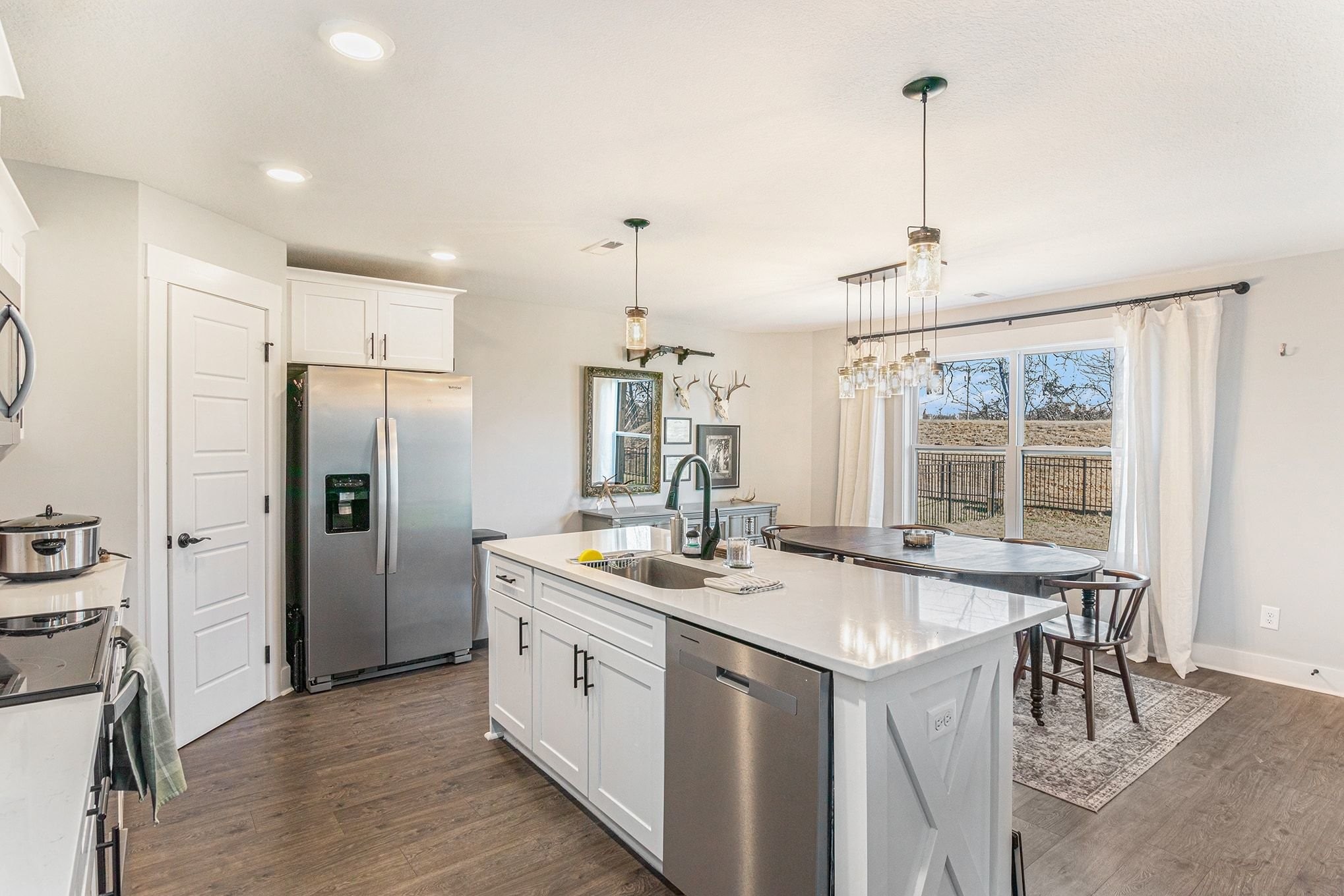 786 Limestone Way Clarksville, TN 37043 - Photo 8 of 29 a kitchen with a sink a stove a refrigerator and island