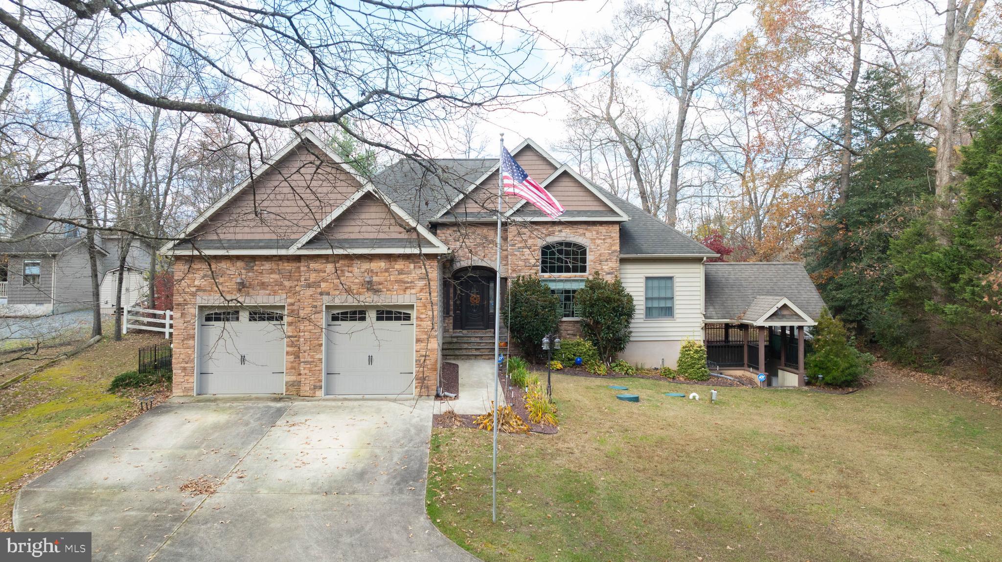 28344 River Road Seaford, DE 19973 - Photo 1 of 62 a front view of a house with a yard and garage