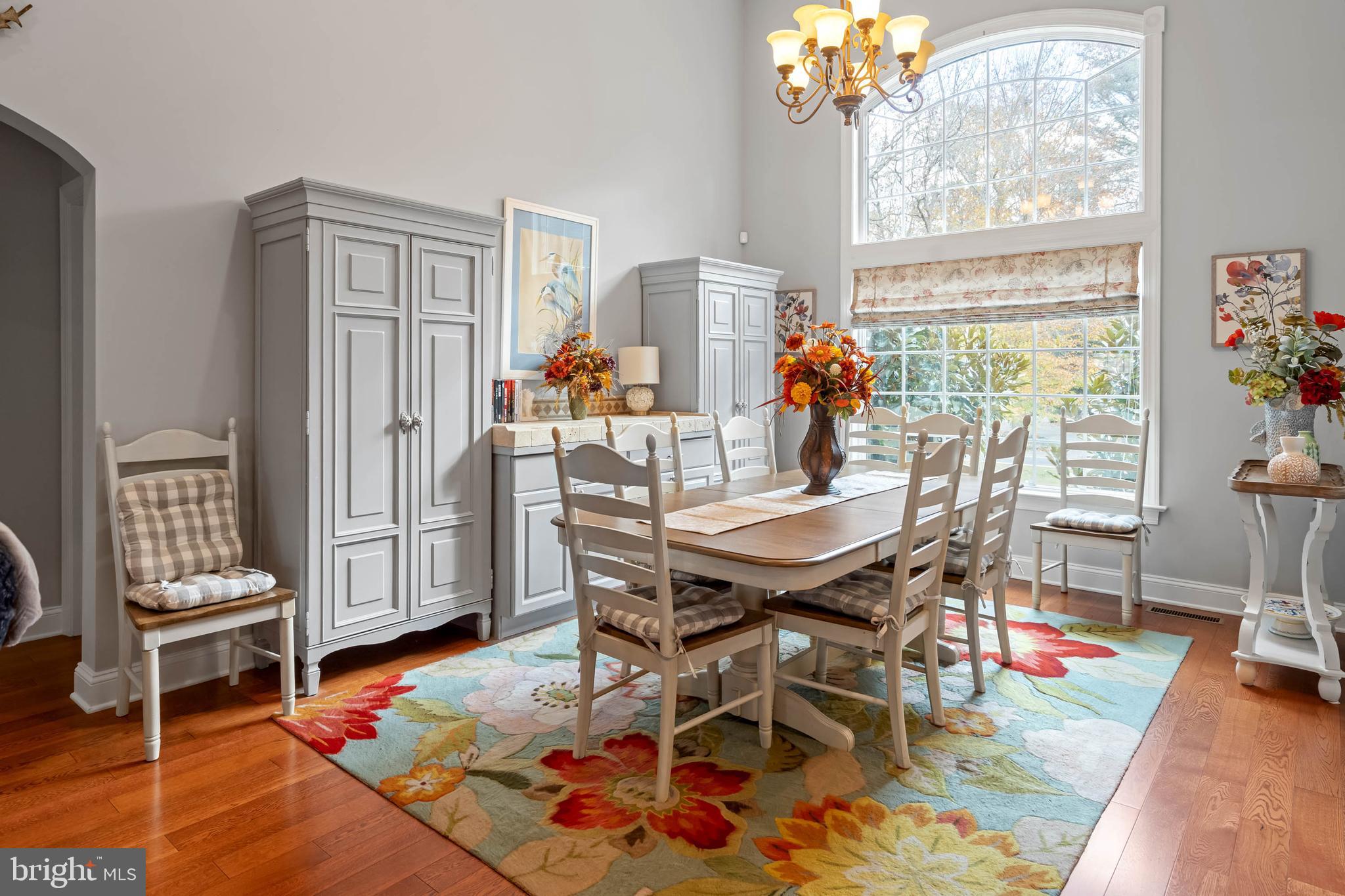 28344 River Road Seaford, DE 19973 - Photo 12 of 62 a dining room with furniture a chandelier and wooden floor