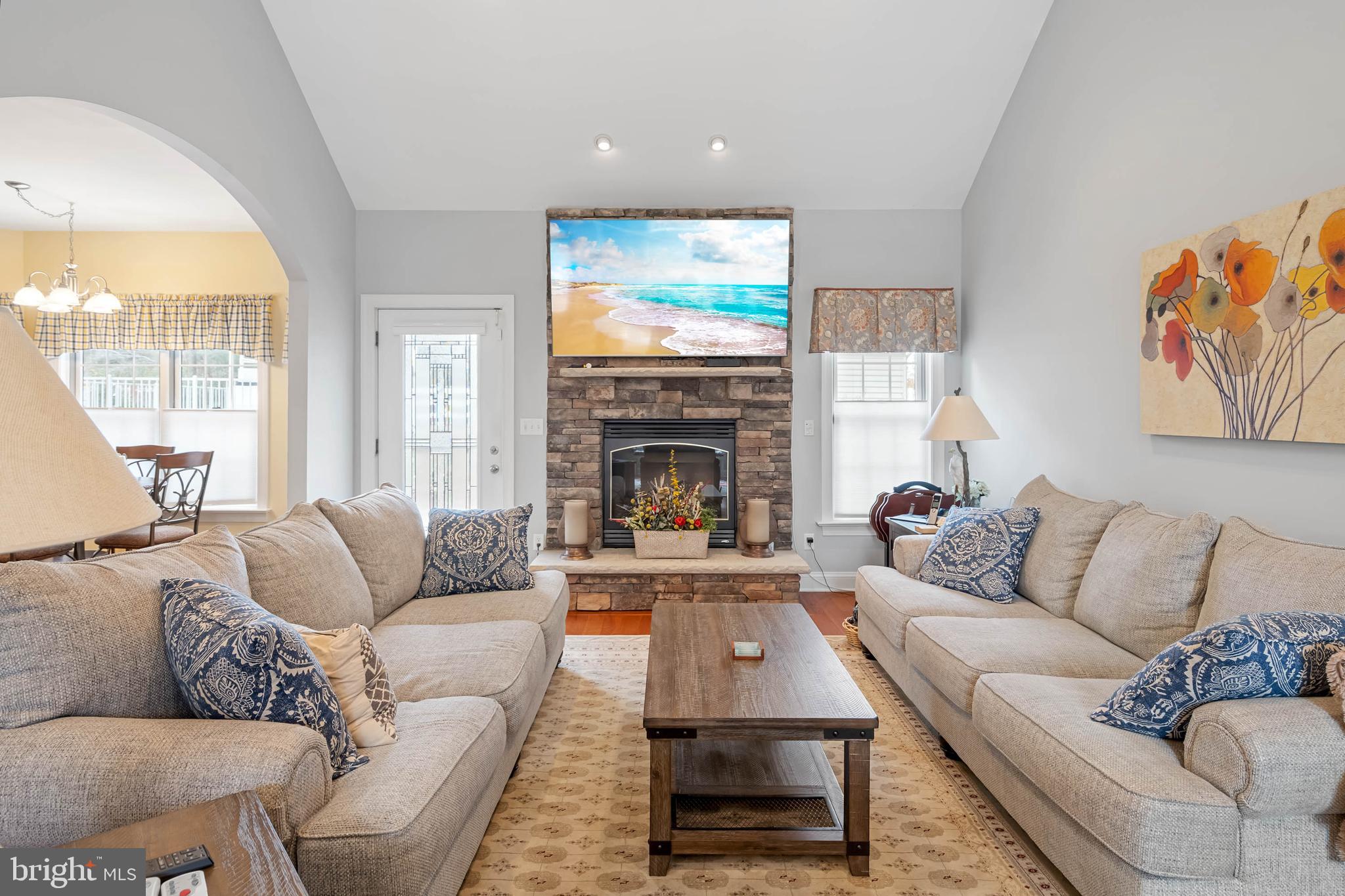 28344 River Road Seaford, DE 19973 - Photo 16 of 62 a living room with furniture a large window and a fireplace