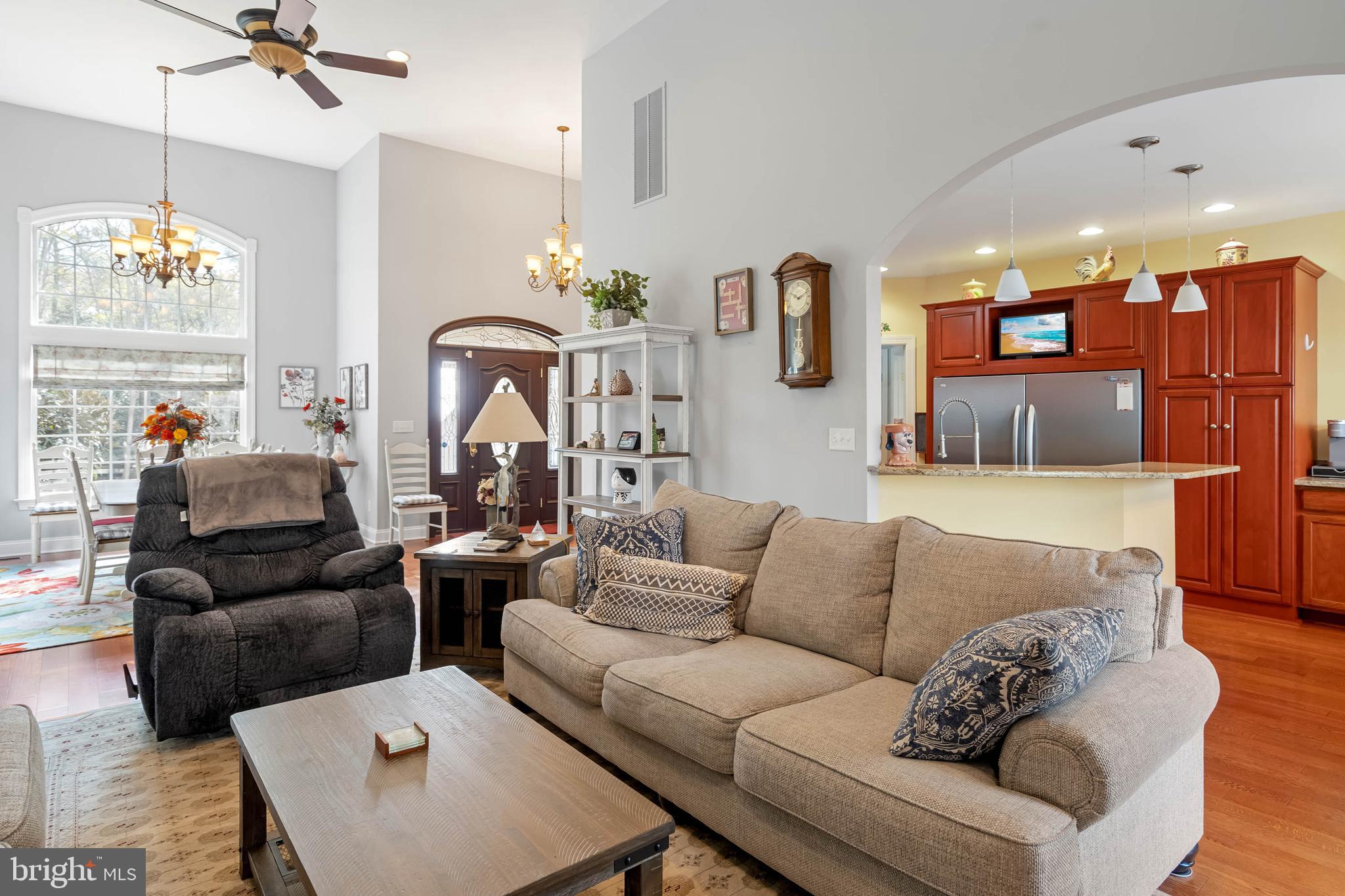 28344 River Road Seaford, DE 19973 - Photo 18 of 62 a living room with furniture kitchen view and a chandelier