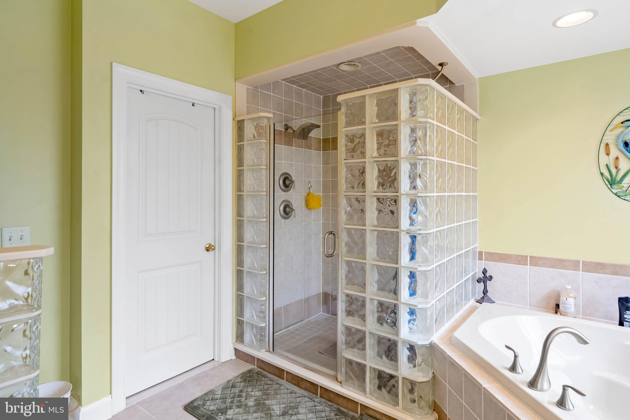 28344 River Road Seaford, DE 19973 - Photo 23 of 62 a bathroom with a tub and shower