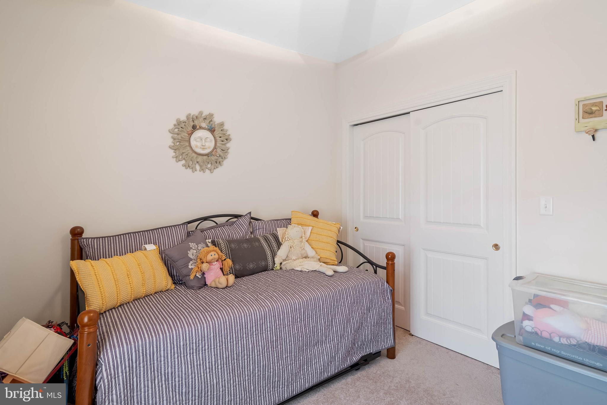 28344 River Road Seaford, DE 19973 - Photo 27 of 62 a bedroom with a bed and a chandelier