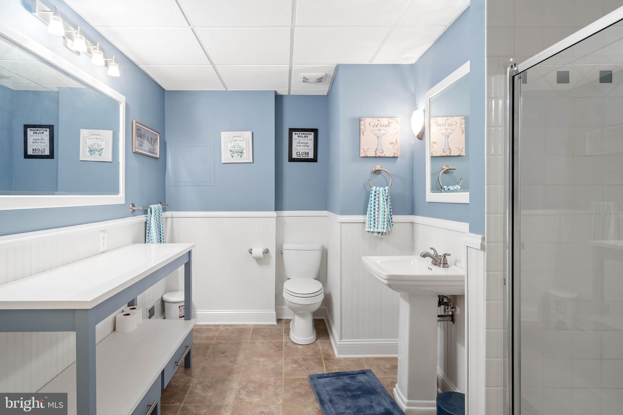 28344 River Road Seaford, DE 19973 - Photo 41 of 62 a bathroom with a sink a toilet and shower