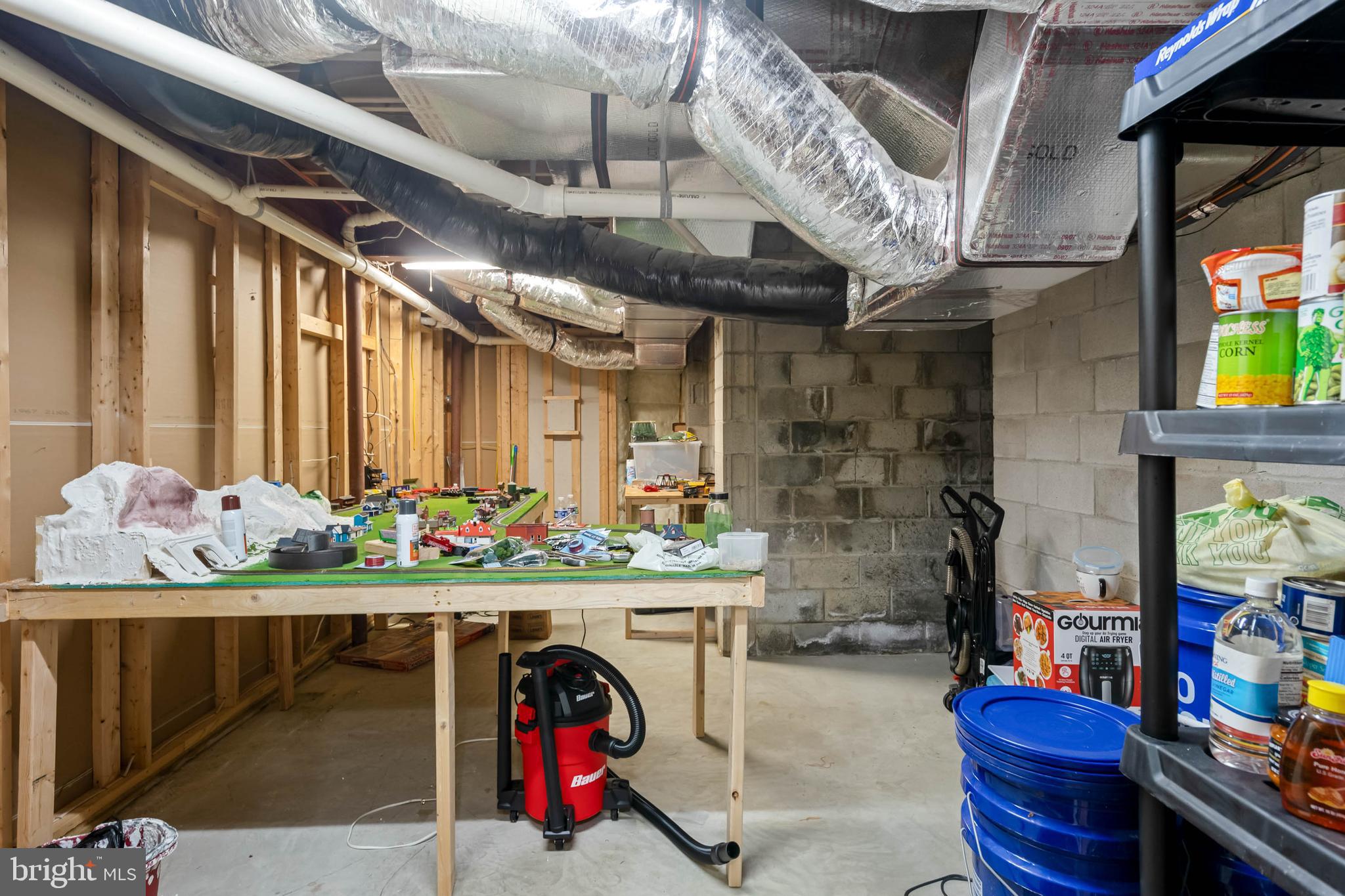 28344 River Road Seaford, DE 19973 - Photo 42 of 62 a room with stainless steel appliances kitchen island granite countertop lots of clutter and lots of stuff
