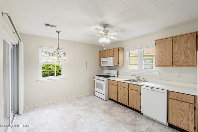 $310,000 | 23 Datchet Close, Unit 1000, Freehold, NJ 07728