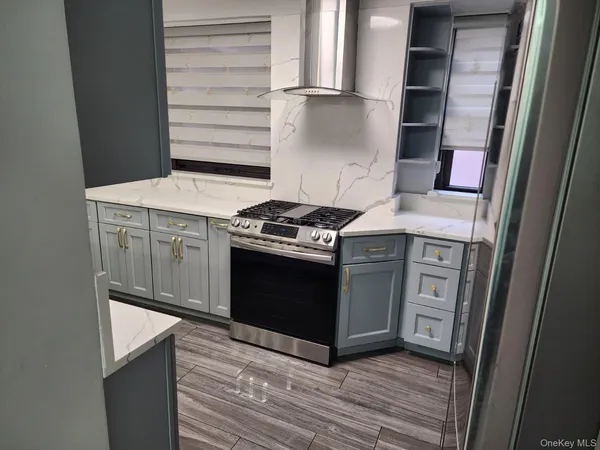 a kitchen with a stove and a refrigerator