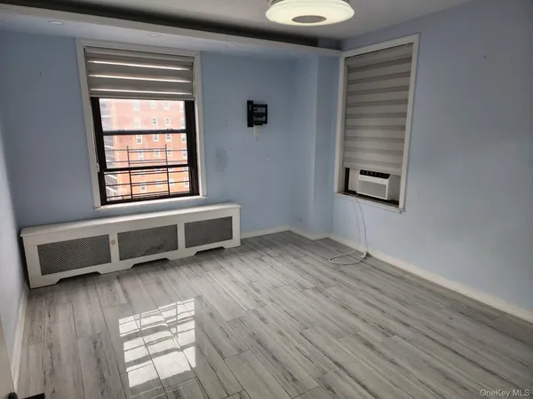 a room with a bed and a window