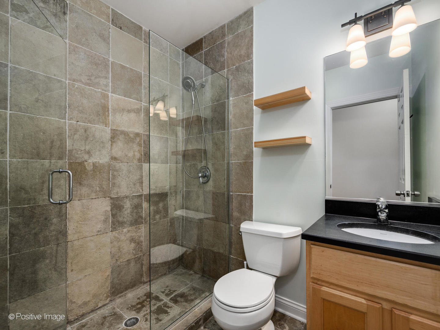 1533 North Campbell Avenue, Unit 2 Chicago, IL 60622 - Photo 13 of 14 a bathroom with a sink a toilet and shower