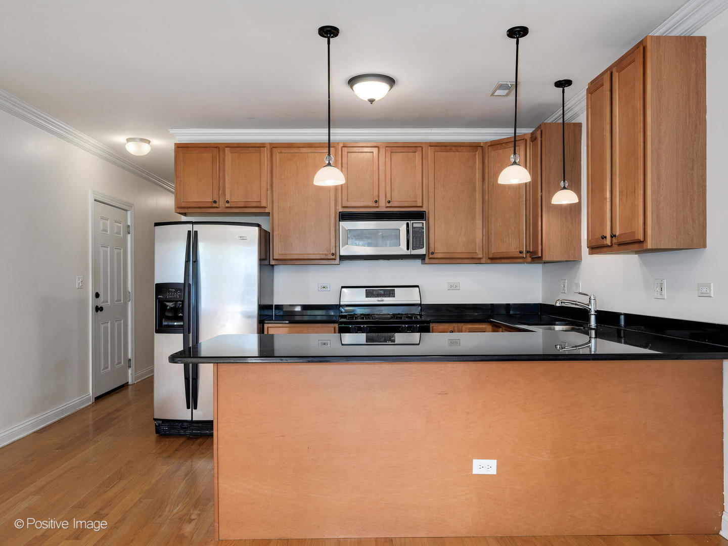 1533 North Campbell Avenue, Unit 2 Chicago, IL 60622 - Photo 7 of 14 a kitchen with stainless steel appliances granite countertop a sink a stove and a refrigerator