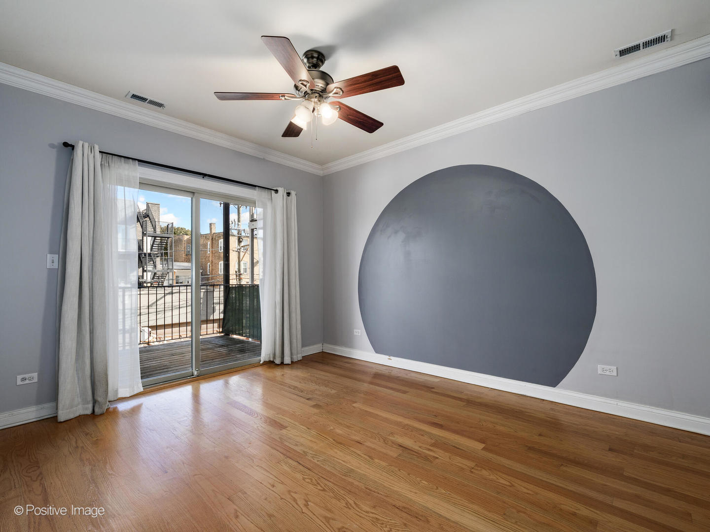 1533 North Campbell Avenue, Unit 2 Chicago, IL 60622 - Photo 10 of 14 a view of an empty room with wooden floor and a window