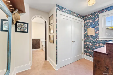 a view of a hallway with wooden floor and entryway