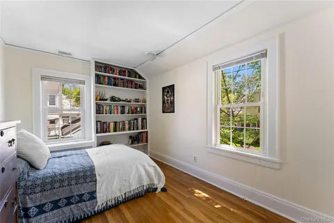 a bedroom with a large bed and a window