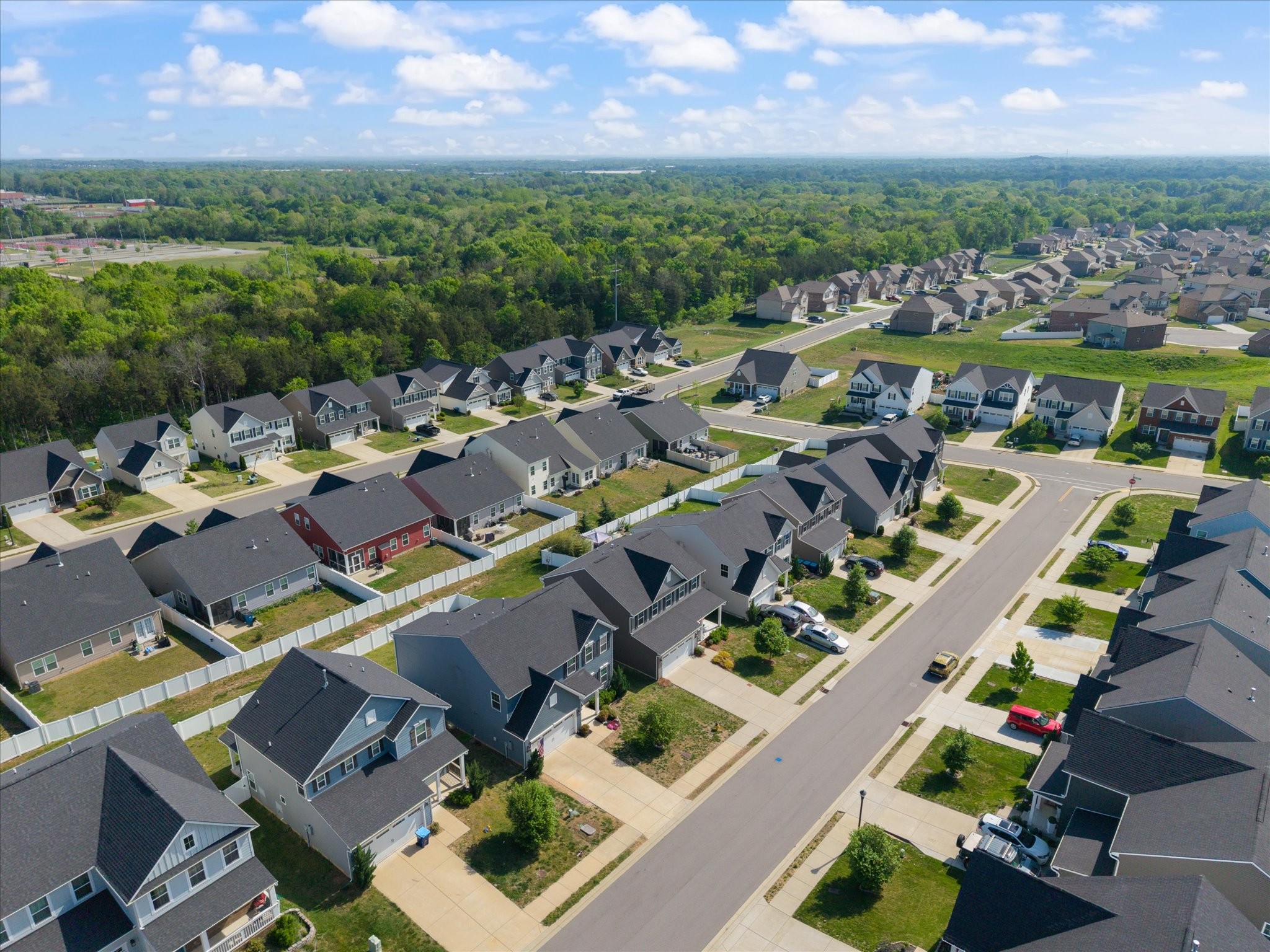 910 Caywood Road Smyrna, TN 37167 - Photo 42 of 49 an aerial view of a city with lots of residential buildings ocean and mountain view in back