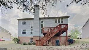 a view of sign board with a small yard