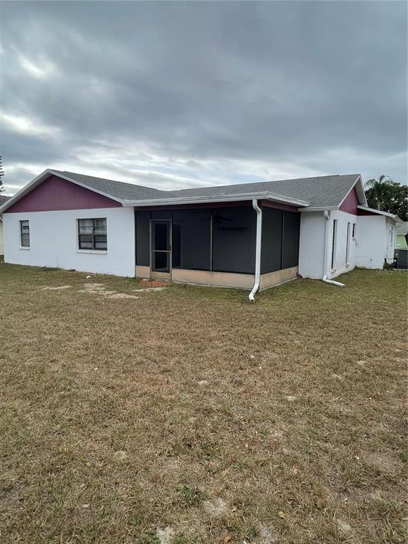 8022 Buttonball Lane Port Richey, FL 34668 - Photo 16 of 21 an empty room with yard