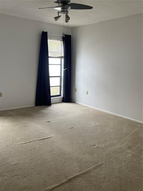 8022 Buttonball Lane Port Richey, FL 34668 - Photo 4 of 21 a view of an empty room with a window