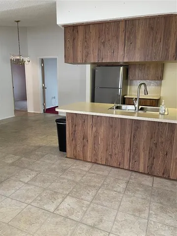 a kitchen with stainless steel appliances a sink and a cabinets