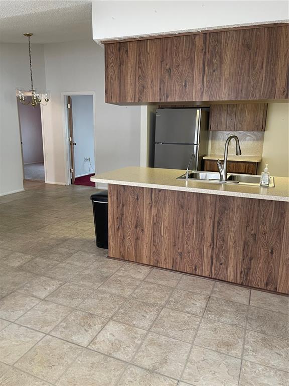 8022 Buttonball Lane Port Richey, FL 34668 - Photo 7 of 21 a kitchen with stainless steel appliances a sink and a cabinets