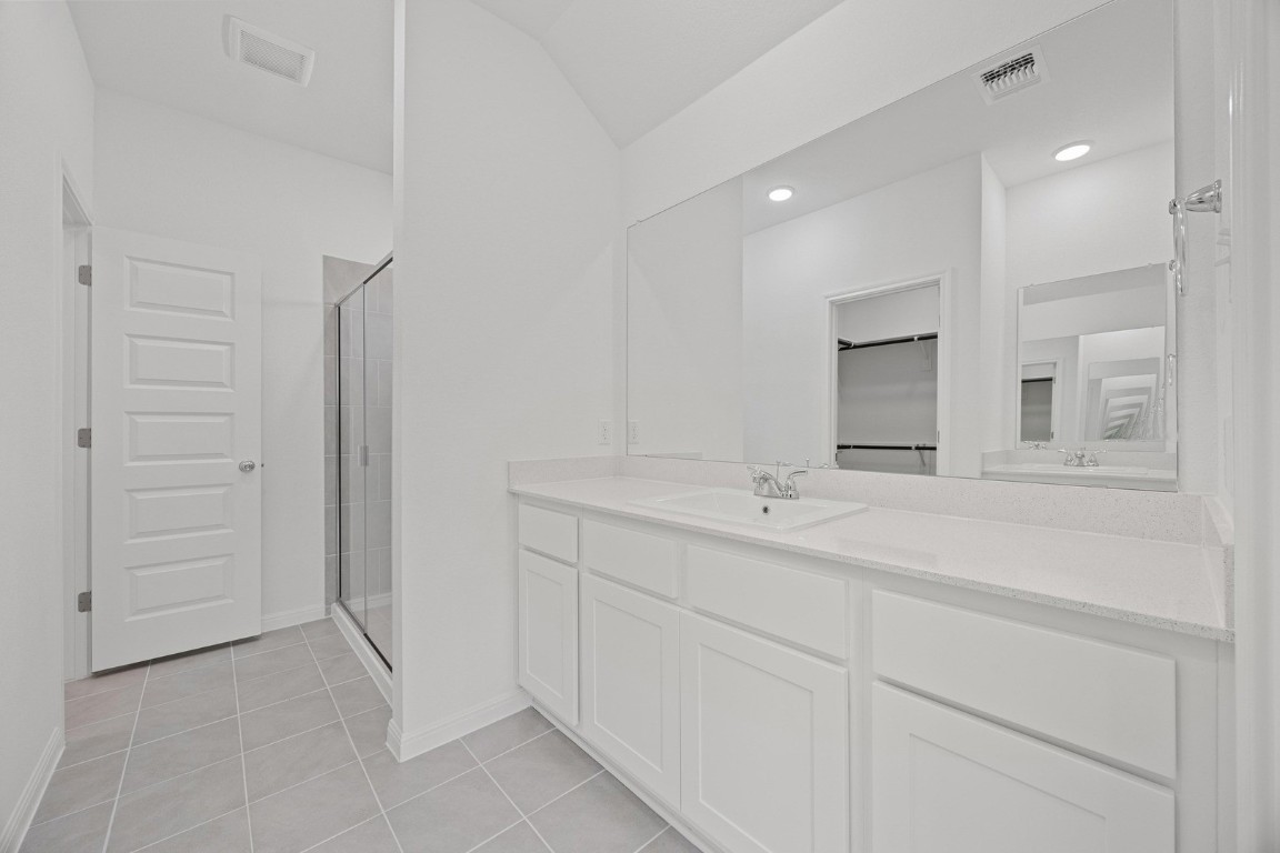 1251 Minorca Street Huffman, TX 77336 - Photo 13 of 24 a bathroom with a sink and a mirror