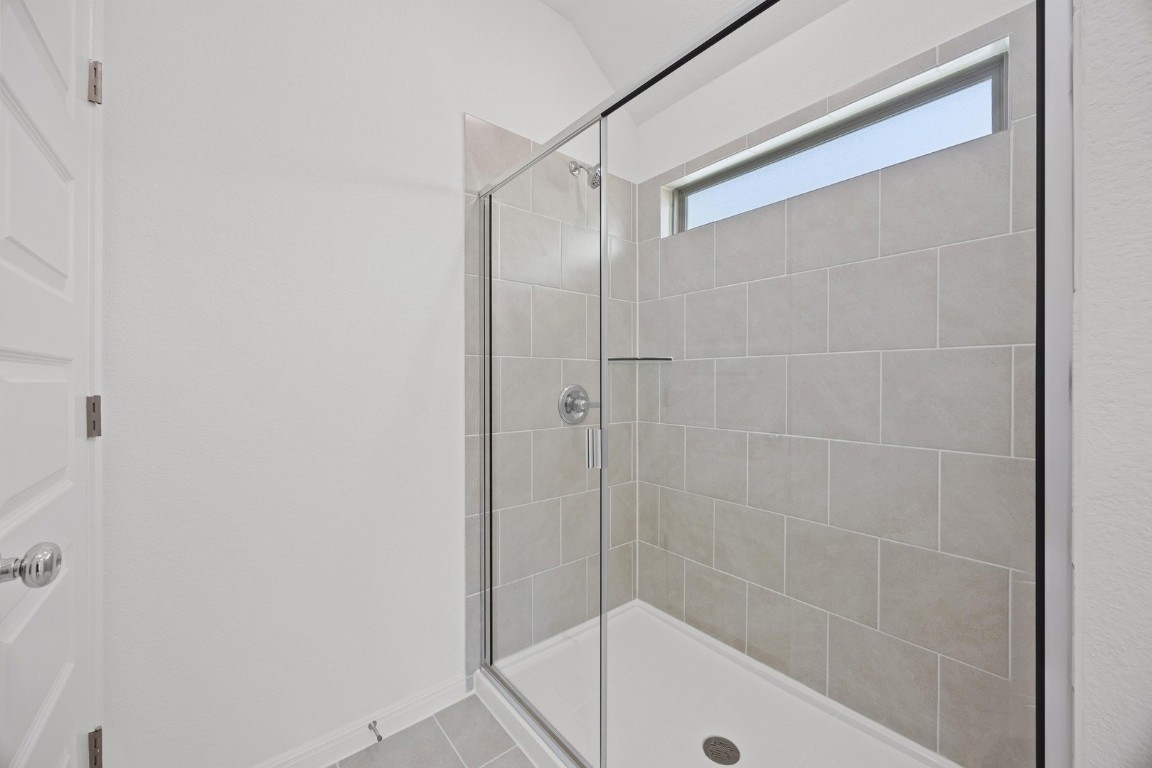 1251 Minorca Street Huffman, TX 77336 - Photo 15 of 24 a bathroom with a shower and a bath tub