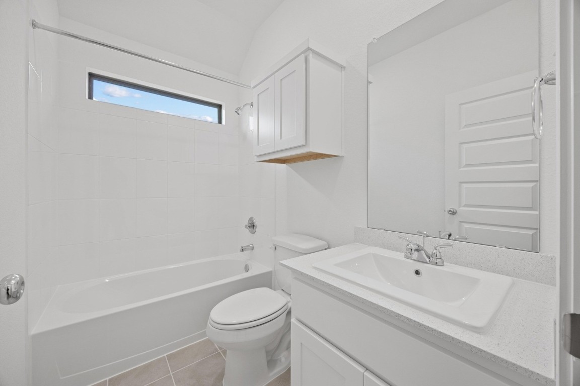 1251 Minorca Street Huffman, TX 77336 - Photo 17 of 24 a bathroom with a sink a toilet and shower