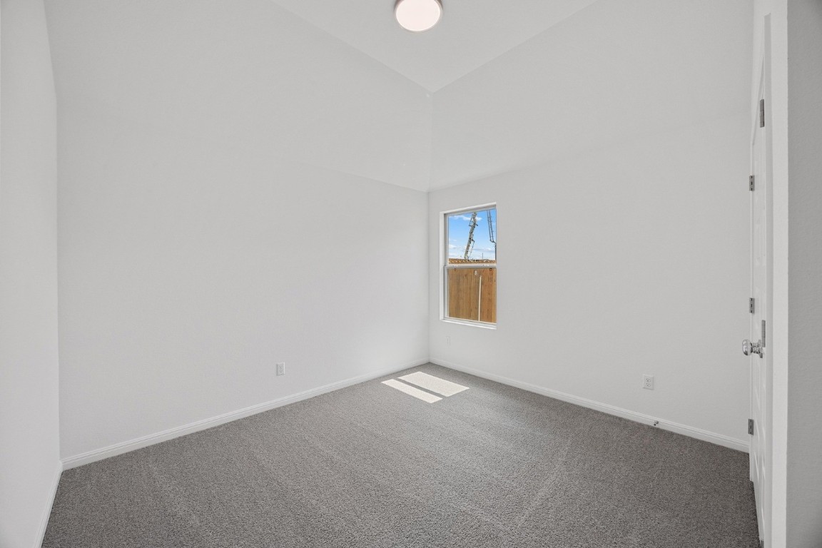 1251 Minorca Street Huffman, TX 77336 - Photo 18 of 24 a view of an empty room with a window