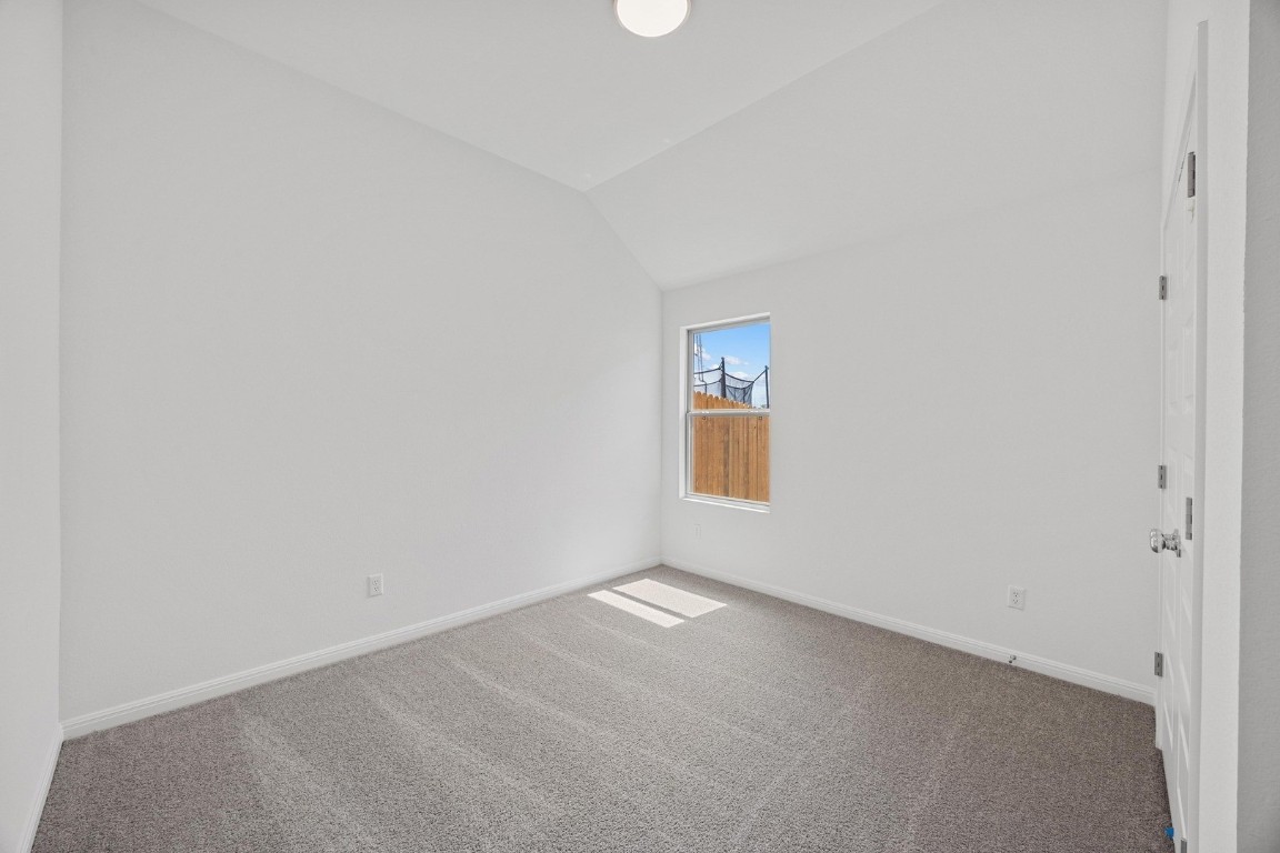 1251 Minorca Street Huffman, TX 77336 - Photo 19 of 24 a view of an empty room and a window