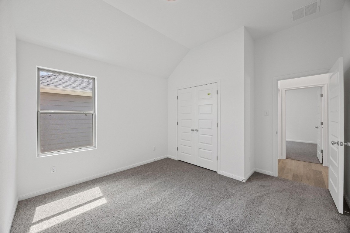 1251 Minorca Street Huffman, TX 77336 - Photo 20 of 24 an empty room with windows and closet