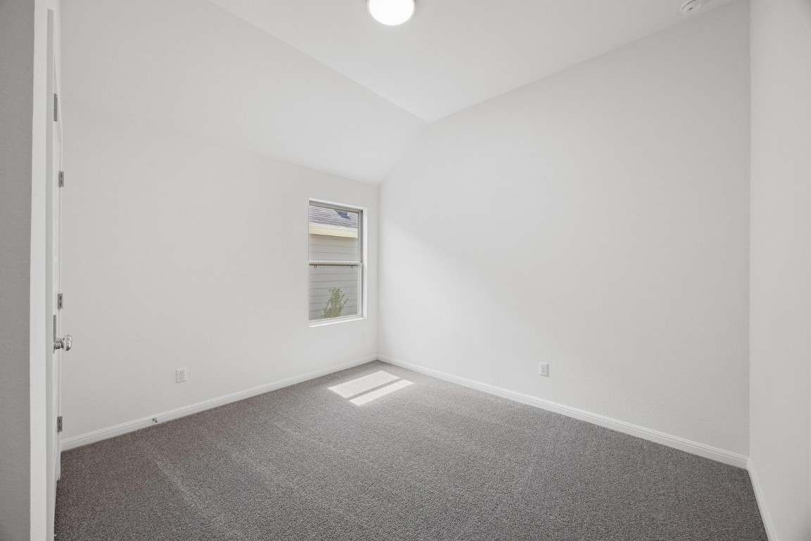 1251 Minorca Street Huffman, TX 77336 - Photo 21 of 24 a view of an empty room with a window