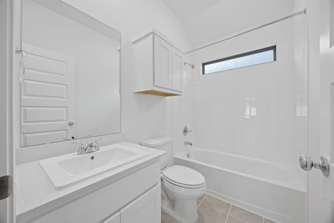 1251 Minorca Street Huffman, TX 77336 - Photo 22 of 24 a bathroom with a sink a toilet and shower