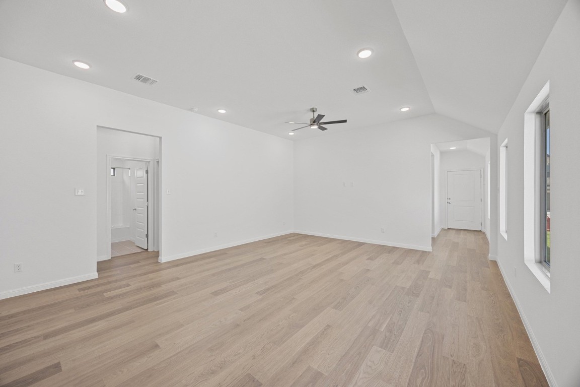 1251 Minorca Street Huffman, TX 77336 - Photo 9 of 24 a view of an empty room with wooden floor