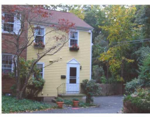 98 Valley Road, Unit 8 Greenwich, CT 06807 - Photo 1 of 1 a front view of a house with plants